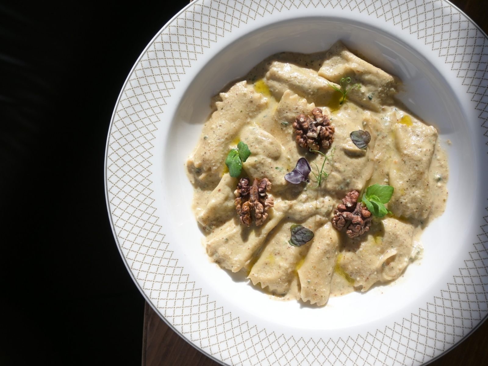 Agnolotti filled with ricotta and wild herbs in walnut sauce